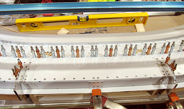 Riveting Close Out Around Hinge Assemblies