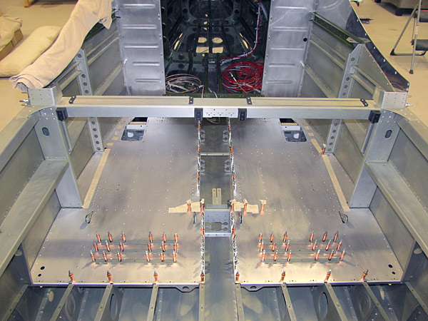 Clecoing Seatback Hinges To Baggage Bin Floors