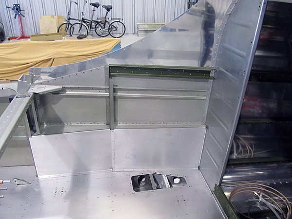 Riveted Baggage Bin Side Covers To Fuselage