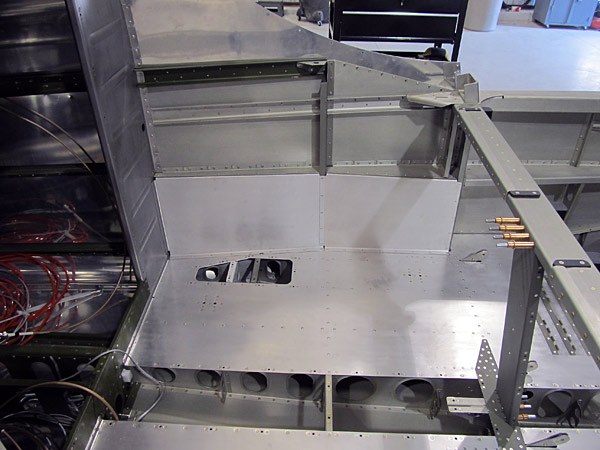 Riveted Baggage Bin Side Covers To Fuselage