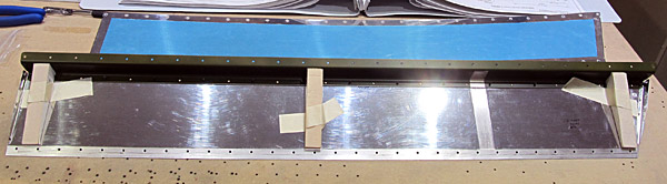 Temporary Taping Of Foam Ribs In Elevator Trim Tab